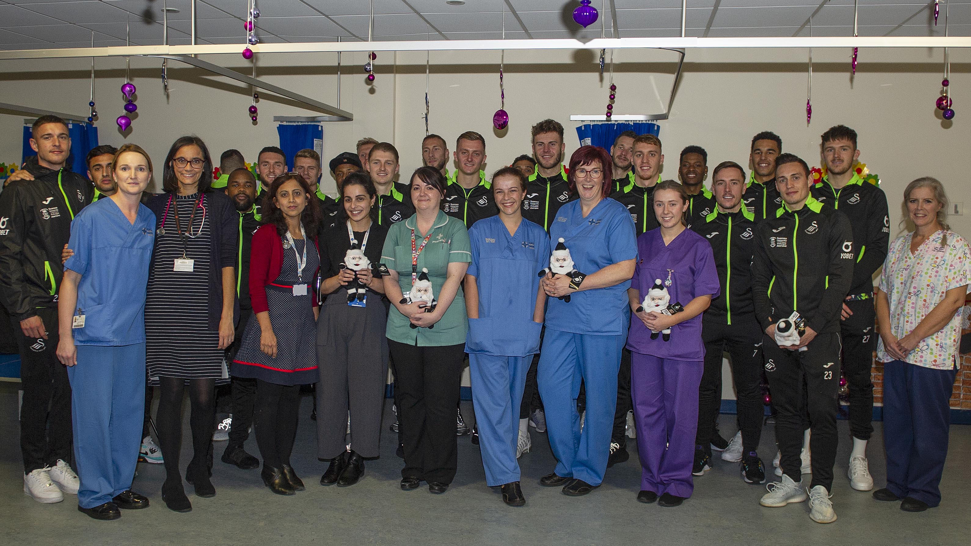 Swansea City squad make hospital visit Swansea